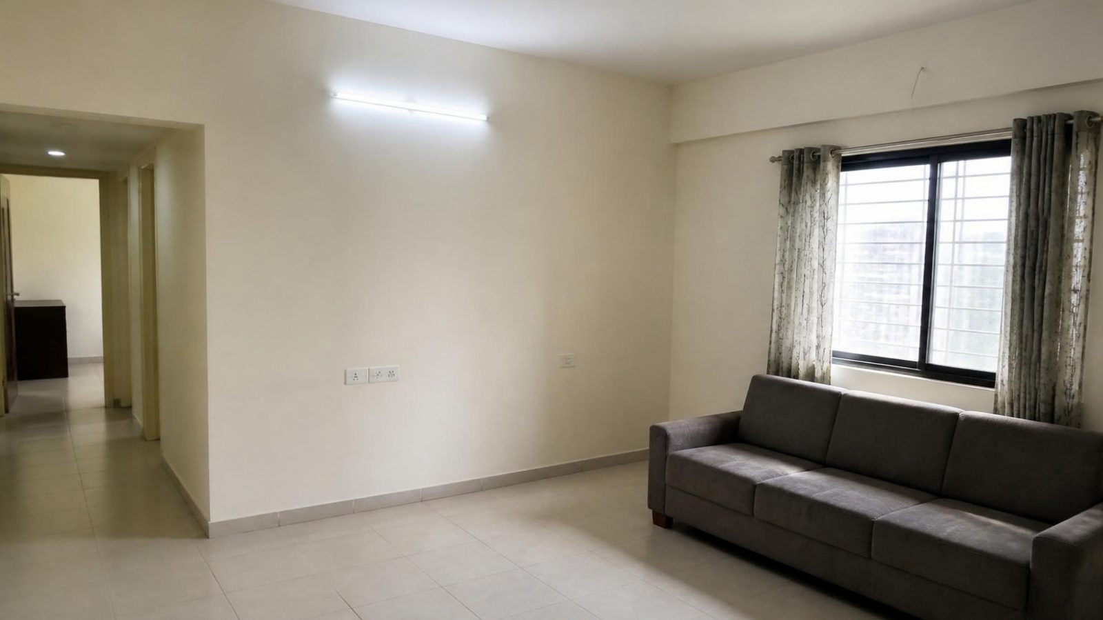 A plain, undecorated living room before upgrading
